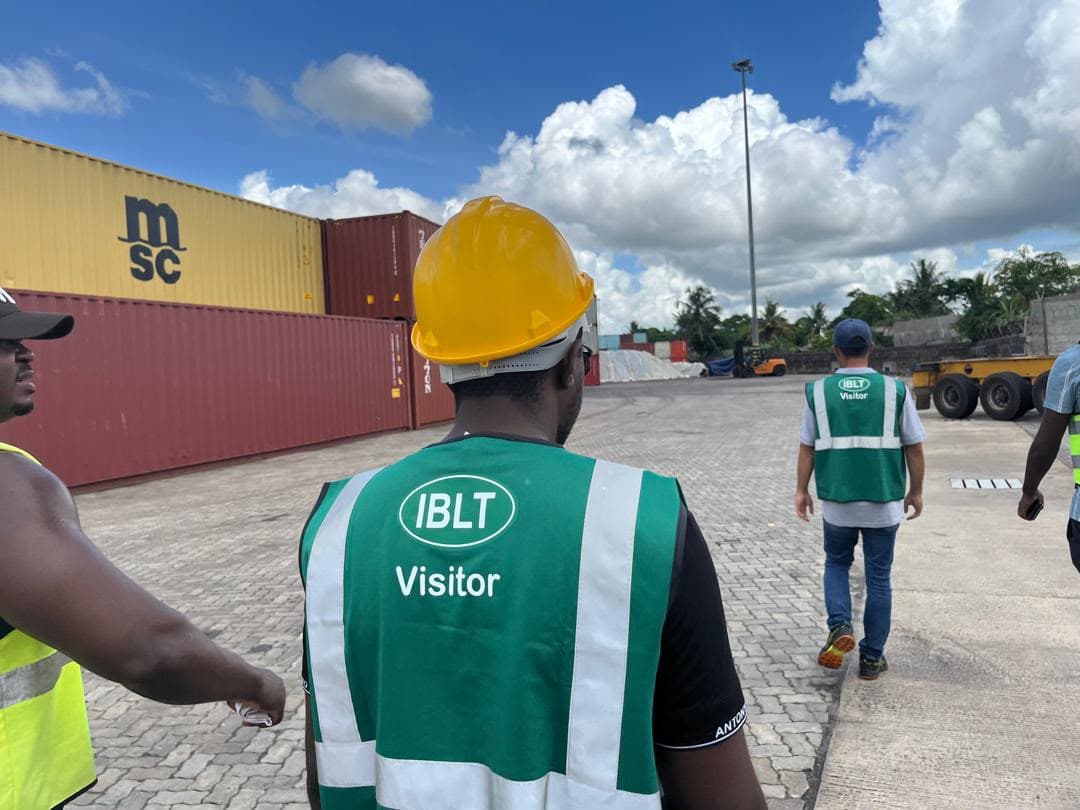 NR staff and partner representatives in high-visibility vests walking a container terminal together