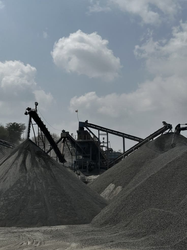 Black African mining workers on heavy mining machinery in protective equipment